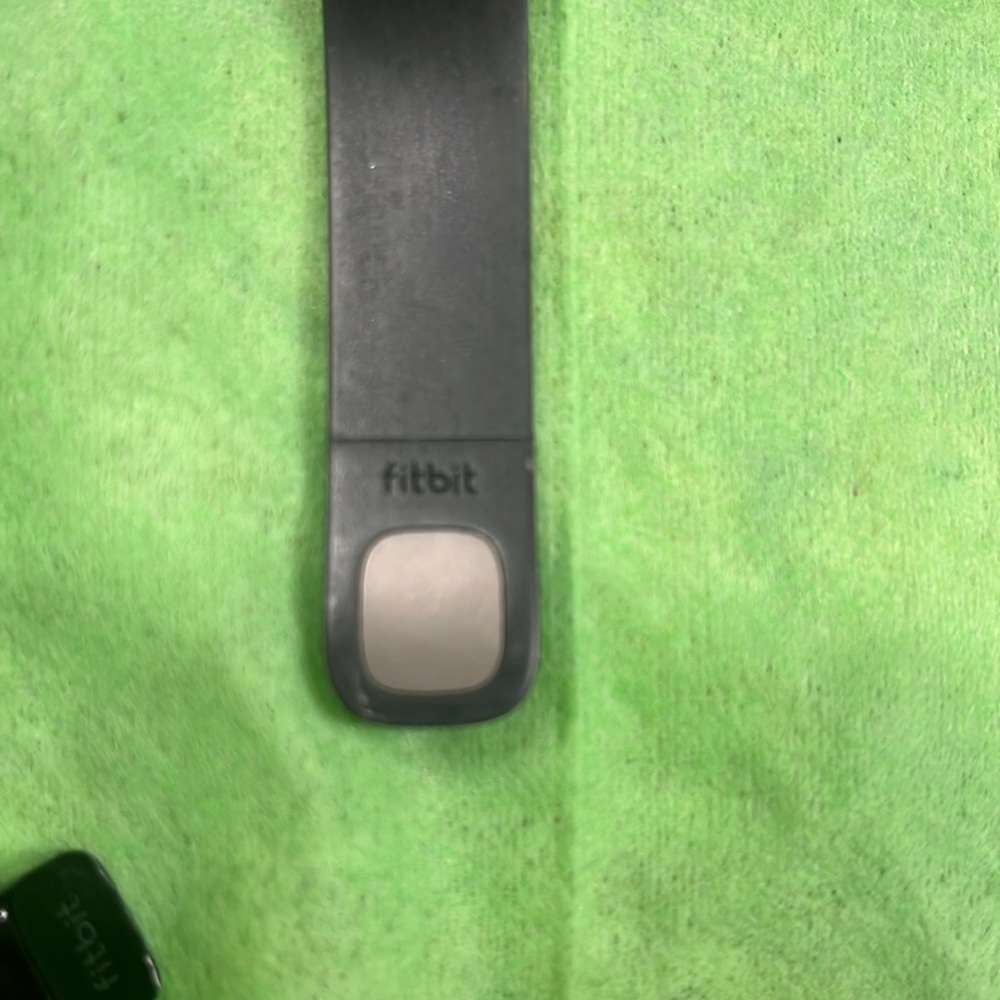 Fitbit Purchased but used twice Cleaning things out so my loss is your gain. SM - Picture 4 of 4